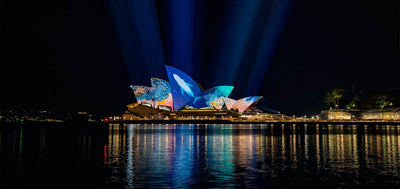 Aerial image of Migaloo lights up Sydney Opera House